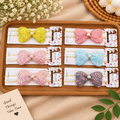 Sequin Bow Hair Band with Pearl Center – Pack of 12 Pcs | Wholesale Price ₹180